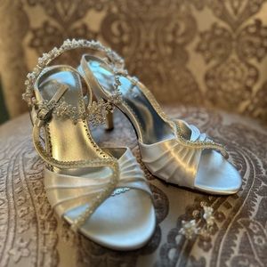 2 inch white satin heels with rhinestone detail.